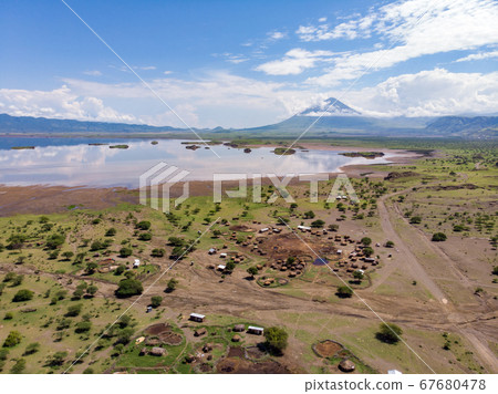 Aerial view of Maasai boma or family rural village on the coast of Salty lake Natron in the Great Rift Valley, Tanzania Aerial view of Maasai boma or family rural village on the coast of Salty lake Natron in the Great Rift Valley, Tanzania 67680478