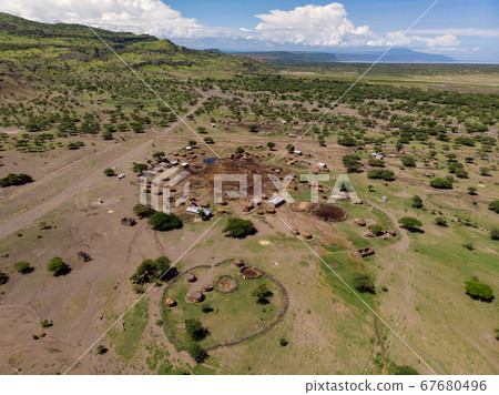 Aerial view of Maasai boma or family rural village on the coast of Salty lake Natron in the Great Rift Valley, Tanzania Aerial view of Maasai boma or family rural village on the coast of Salty lake Natron in the Great Rift Valley, Tanzania 67680496