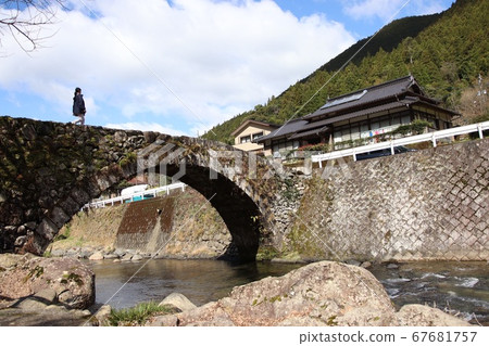 People walking across Kasamatsu Bridge People walking across Kasamatsu Bridge 67681757