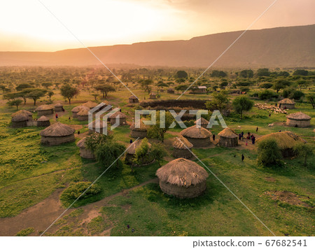 Aerial Drone Shot. Traditional Masai village at Sunset time near Arusha, Tanzania Aerial Drone Shot. Traditional Masai village at Sunset time near Arusha, Tanzania 67682541