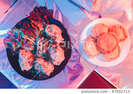 National Uzbek Dishes manti on clay plates, hot red pepper, ayran, parsley, spices are lying on a wooden table. 67682713