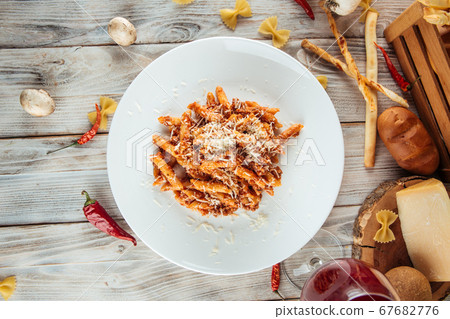 Italian penne pasta bolognese beef and parmesan Italian penne pasta bolognese beef and parmesan 67682776