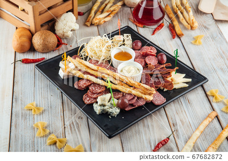 Wine appetizer set smoked sausages cheese honey Wine appetizer set smoked sausages cheese honey 67682872