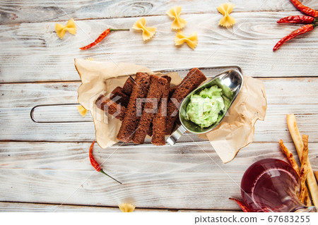 Appetizer croutons from borodino bread with garlic Appetizer croutons from borodino bread with garlic 67683255