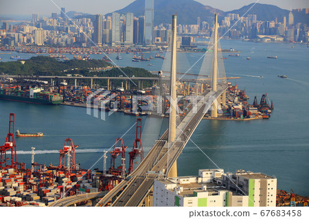Kwai Tsing container terminal port view in drone, and hong kong skyline and stonecutter's bridge 67683458