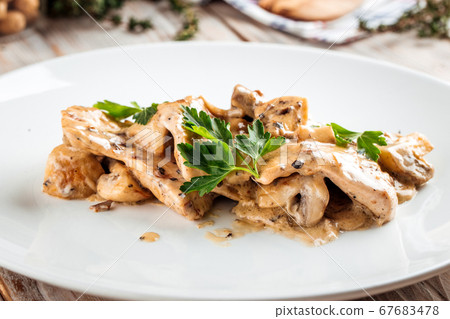 Tender chicken fillet mushrooms and creamy sauce Tender chicken fillet mushrooms and creamy sauce 67683478