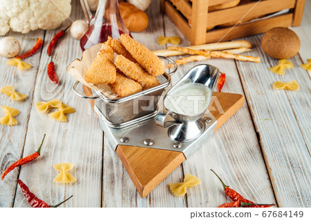 Breaded fried tender mozzarella with tartar sauce 67684149