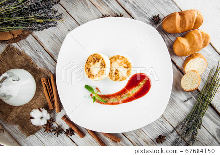 Russian cottage cheese pancake syrniki berry sauce Russian cottage cheese pancake syrniki berry sauce 67684150