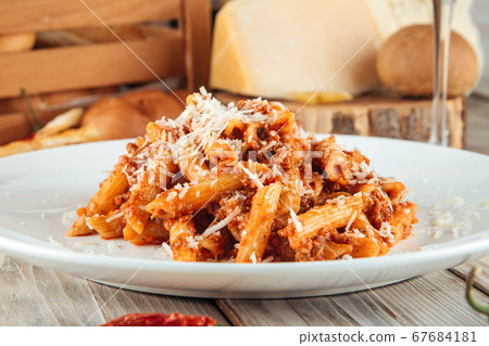Italian penne pasta bolognese beef and parmesan Italian penne pasta bolognese beef and parmesan 67684181