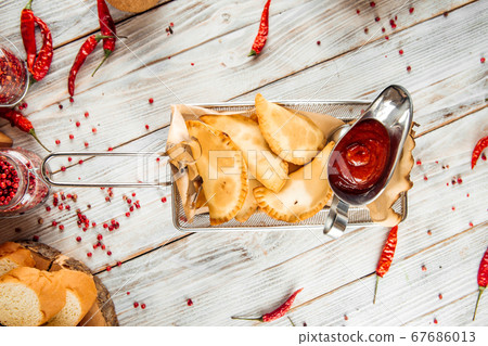 Snack appetizer small chebureks fried meat pies 67686013