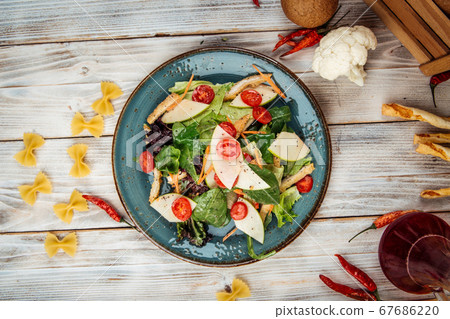 Gourmet salad with turkey apple greens vegetables 67686220