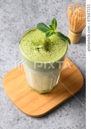 Glass of dalgona iced matcha tea Glass of dalgona iced matcha tea 67687251