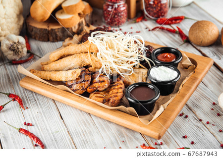 Big assorted chicken platter set with sauces Big assorted chicken platter set with sauces 67687943