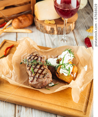 New york beef steak baked potatoes  sour cream  New york beef steak baked potatoes  sour cream  67688029