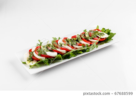Side view on isolated classic caprese salad  67688599