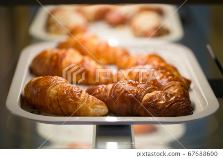 Selective focus on croissants on a white tray 67688600