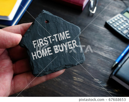 First time home buyer words on the stone house symbol. First time home buyer words on the stone house symbol. 67688653