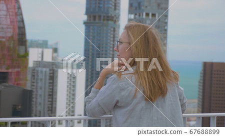 Woman Enjoying Singapore City View 67688899
