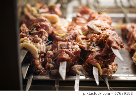 Selective focus on prepared raw skewers shashlyq 67689198