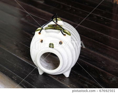 A summer tradition. Burning mosquito coil with a mosquito pig on the veranda. 67692501