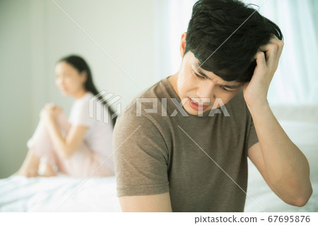 Young couple couple having a fight in bedroom 67695876