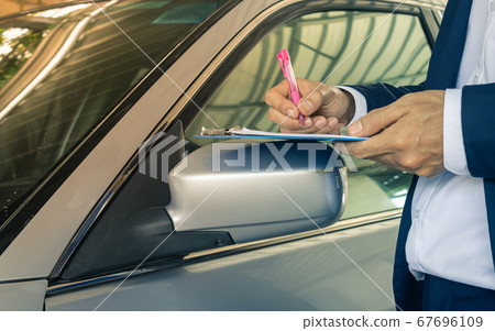 Standing Pose Asian Insurance Agent or Insurance Agency Write Car Crash Report in Zoom View in Vintage Tone Standing Pose Asian Insurance Agent or Insurance Agency Write Car Crash Report in Zoom View in Vintage Tone 67696109