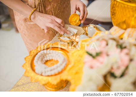 The bride is preparing things for her wedding ceremony in Thai style. The bride is preparing things for her wedding ceremony in Thai style. 67702054
