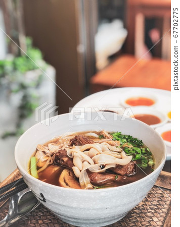 Chinese Roast Duck Noodle Soup Recipe on wooden table Chinese Roast Duck Noodle Soup Recipe on wooden table 67702775