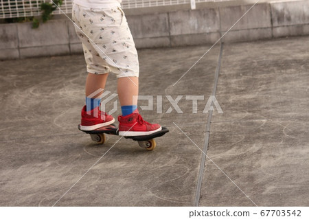 Elementary school student riding a Brevo successfully Elementary school student riding a Brevo successfully 67703542