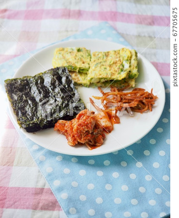 Korean side dishes: seaweed, rolled eggs, kimchi, and shredded squid 67705675