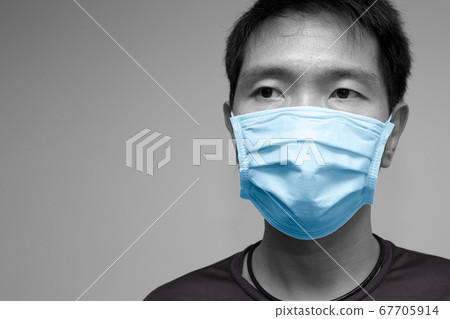 Asian chinese man wearing face mask or disposable protective face shield Asian chinese man wearing face mask or disposable protective face shield 67705914