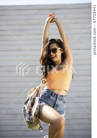 Pretty brunette girl in shorts feeling amazing 67708441