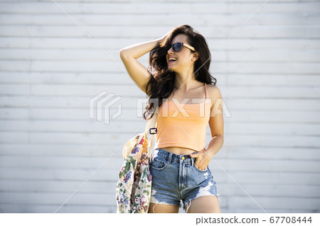 Pretty brunette girl in shorts feeling great 67708444