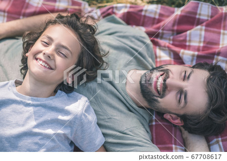 Dad and son enjoying the day together 67708617