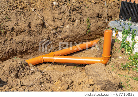 Plastic pipes in the ground for rainwater drainage 67710832