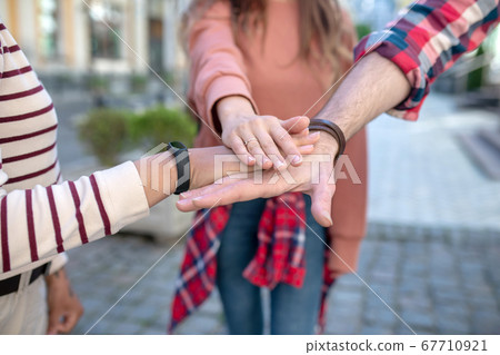 Male hand and two female gestures showing fidelity to friendship Male hand and two female gestures showing fidelity to friendship 67710921