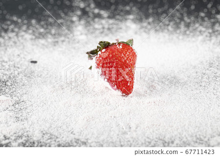 A single stawberry on the flour A single stawberry on the flour 67711423