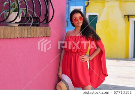 Beautiful young woman in red dress and sunglasses, Beautiful young woman in red dress and sunglasses, 67713191