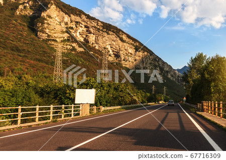Road in the Alp mountains of Austria, summer view Road in the Alp mountains of Austria, summer view 67716309