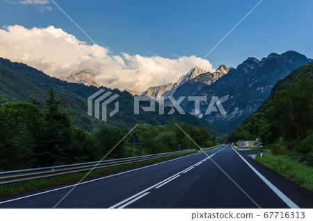 Empty road in the Alps valley, Italy Empty road in the Alps valley, Italy 67716313