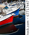 Boats reflecting in the water 67717447