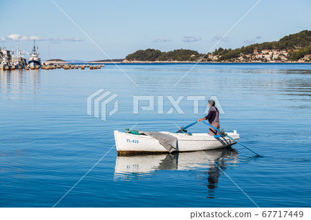 Reflections of a fishing boat at Vela Luka Reflections of a fishing boat at Vela Luka 67717449