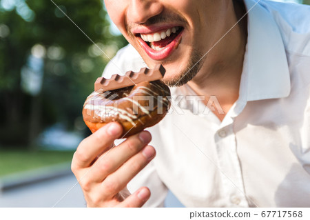 close up view of handsome caucasian young man in close up view of handsome caucasian young man in 67717568