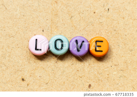 Round color bead with black letter in word love 67718335