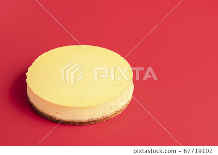 Classic cheesecake on a red background. Homemade Classic cheesecake on a red background. Homemade 67719102