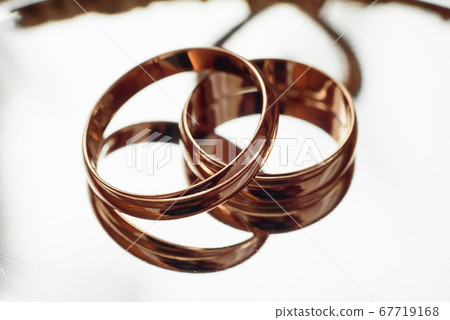 two traditional wedding gold engagement rings close-up 67719168