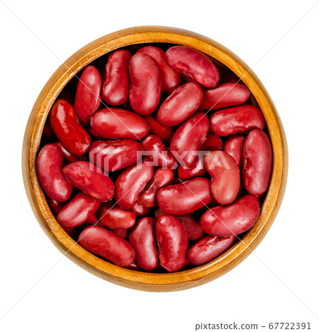 Canned red kidney beans in wooden bowl, also known as common kidney bean, Rajma or Surkh. A variety of the common bean, Phaseolus vulgaris. Closeup, from above, over white, isolated, macro food photo. Canned red kidney beans in wooden bowl, also known as common kidney bean, Rajma or Surkh. A variety of the common bean, Phaseolus vulgaris. Closeup, from above, over white, isolated, macro food photo. 67722391