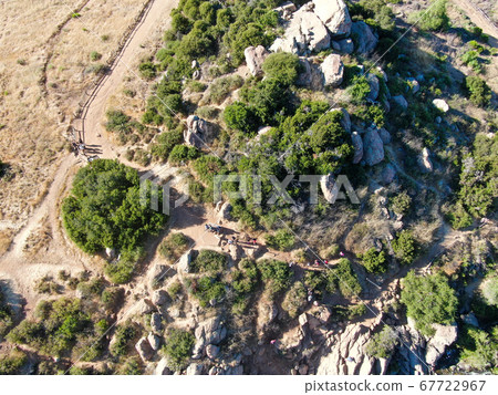 Aerial view of Los Penasquitos Canyon Preserve with tourist and hikers looking at the view, San Diego 67722967