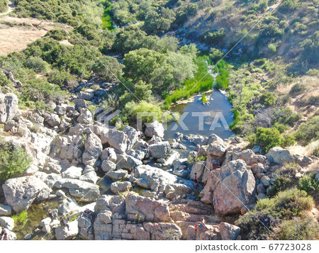 Aerial view of Los Penasquitos Canyon Preserve with the creek waterfall, San Diego 67723028