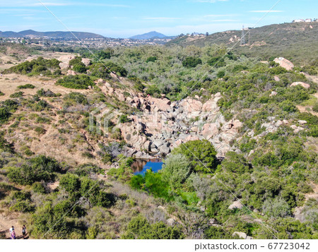 Aerial view of Los Penasquitos Canyon Preserve with the creek waterfall, San Diego 67723042